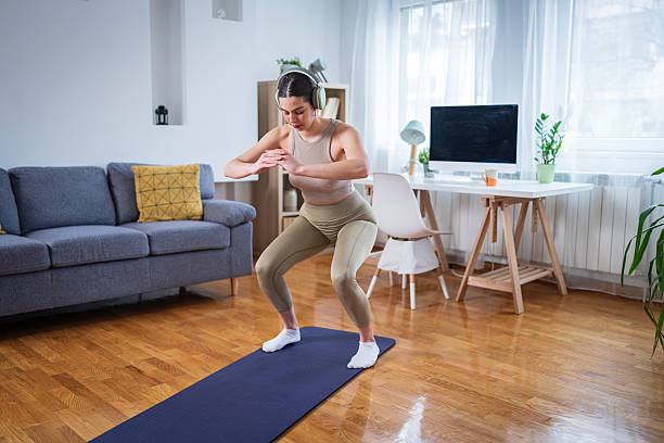 Stretching routine on a yoga mat near a window